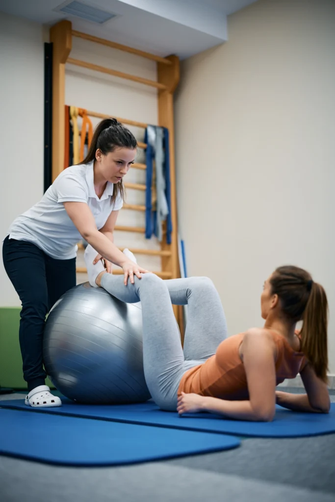 physiotherapist using fitness ball during therapeu 2024 12 13 16 42 43 utc